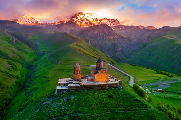 Aerial view of Gergeti trinity church at sunrise in Georgia.